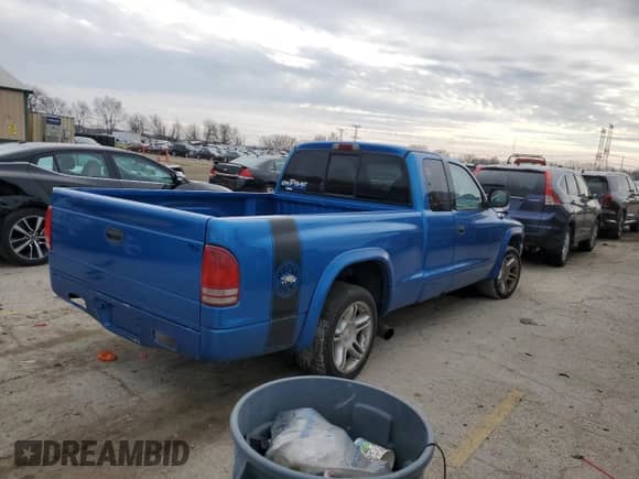 1999 Dodge Dakota Sport z VIN 1B7GL22Z7XS110023, wystawiony jako Copart lot #85889754 z przebiegiem Nie podano mil oraz Szkoda całkowita • Salvage title. Historia ofert i sprzedaży dostępna na DreamBid. Obrazek 3.