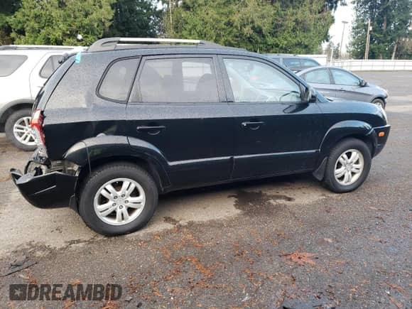 2007 Hyundai Tucson SE z VIN KM8JN72D97U671082, wystawiony jako Copart lot #81786064 z przebiegiem 122 431 mil mil oraz Szkoda całkowita • Salvage title. Historia ofert i sprzedaży dostępna na DreamBid. Obrazek 3.