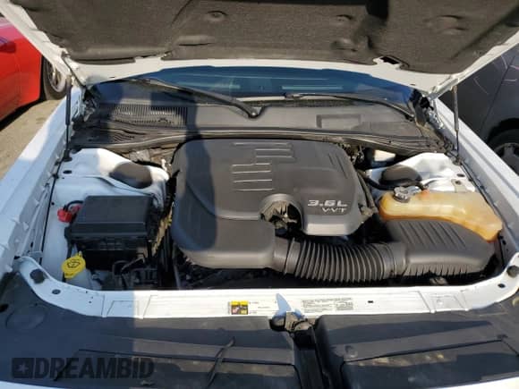 2013 Dodge Challenger SXT z VIN 2C3CDYAGXDH675954, wystawiony jako Copart lot #63340634 z przebiegiem 69 699 mil mil oraz Szkoda całkowita • Salvage title. Historia ofert i sprzedaży dostępna na DreamBid. Obrazek 11.