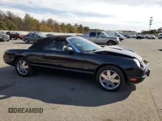 ✅ 2003 Ford Thunderbird Deluxe • VIN: 1FAHP60A63Y104093 • Лот: 76028744. Опубликован ранее на Copart с пробегом 79 995 миль. Бесплатный доступ к архиву аукционных продаж из США и подробный отчёт об истории автомобиля на DreamBid. Изображение 4.
