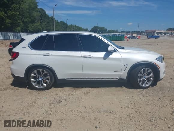 ✅ 2018 BMW X5 xDrive40e • VIN: 5UXKT0C51J0V98736 • Lot: 42859281. Listed on IAAI with 100,979 mi. Free auction sales archive from the USA and detailed vehicle history report at DreamBid. Image 13.