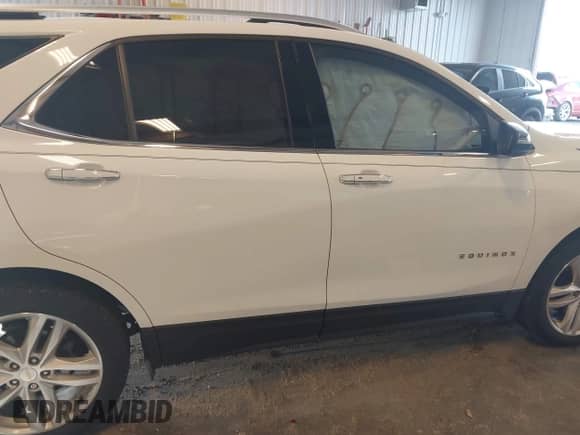2020 Chevrolet Equinox Premier z VIN 3GNAXYEX3LS534571, wystawiony jako IAAI lot #43458472 z przebiegiem 116 711 mil mil oraz . Historia ofert i sprzedaży dostępna na DreamBid. Obrazek 13.