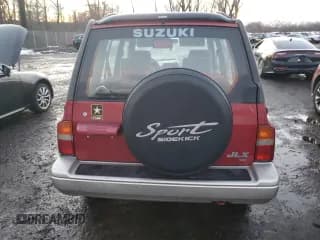 ✅ 1996 Suzuki Sidekick • VIN: JS3TD21V2T4103586 • Lot: 83492154. Listed on Copart with 98,298 mi. Free auction sales archive from the USA and detailed vehicle history report at DreamBid. Image 6.