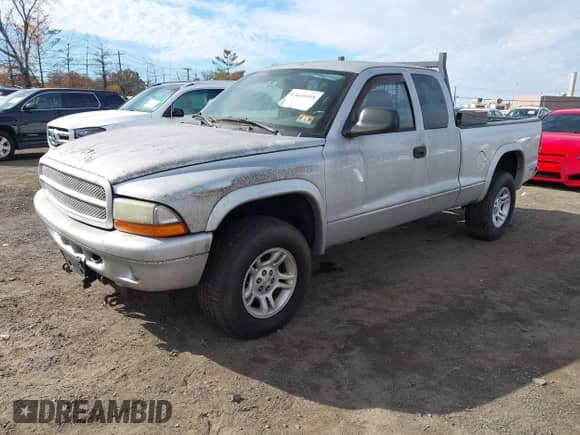 2003 Dodge Dakota Sport with VIN 1D7HG32N43S138938, listed as a IAAI auction lot 43610418 with 112,101 mi miles and . Bid and sale history available at DreamBid. Image 2.