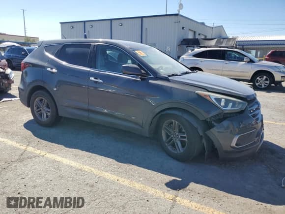 ✅ 2018 Hyundai Santa Fe 2.4L • VIN: 5XYZT3LB9JG523560 • Lot: 81779345. Listed on Copart with 106,399 mi. Free auction sales archive from the USA and detailed vehicle history report at DreamBid. Image 4.