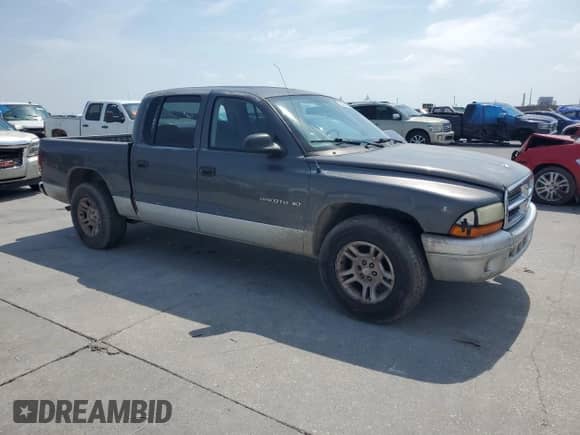 2002 Dodge Dakota SLT z VIN 1B7HL48X52S688636, wystawiony jako Copart lot #53062325 z przebiegiem 224 011 mil mil oraz Szkoda całkowita • Salvage title. Historia ofert i sprzedaży dostępna na DreamBid. Obrazek 4.