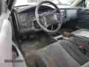 2003 Dodge Dakota Sport z VIN 1D7HG32N43S102313, wystawiony jako Copart lot #70307144 z przebiegiem 139 079 mil mil oraz Szkoda całkowita • Salvage title. Historia ofert i sprzedaży dostępna na DreamBid. Obrazek 8.