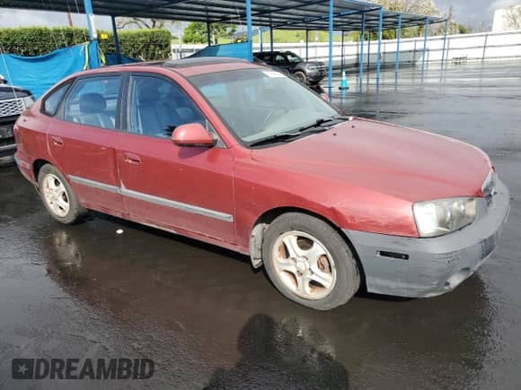 2002 Hyundai Elantra GT z VIN KMHDN55D52U068507, wystawiony jako Copart lot #50656835 z przebiegiem 201 909 mil mil oraz Szkoda całkowita • Salvage title. Historia ofert i sprzedaży dostępna na DreamBid. Obrazek 4.