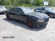 ✅ 2013 Dodge Charger SXT Plus • VIN: 2C3CDXJG1DH584579 • Lot: 42128401. Listed on IAAI with 100,388 mi. Free auction sales archive from the USA and detailed vehicle history report at DreamBid. Image 1.