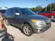 2012 Hyundai Santa Fe Limited с VIN 5XYZK4AG1CG144109, выставлен на аукционе Copart как лот 74305014 с пробегом Не указан миль и На запчасти • Non repairable. История ставок и продаж доступна на DreamBid. Изображение 4.