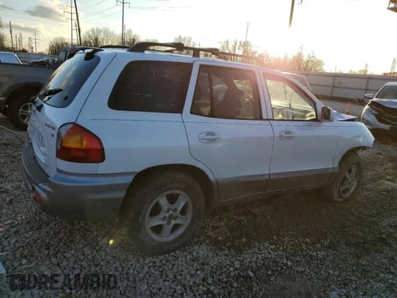 2004 Hyundai Santa Fe GLS z VIN KM8SC13DX4U664028, wystawiony jako Copart lot #87284344 z przebiegiem Nie podano mil oraz Szkoda całkowita • Salvage title. Historia ofert i sprzedaży dostępna na DreamBid. Obrazek 3.