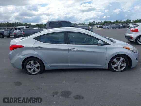 ✅ 2013 Hyundai Elantra GLS • VIN: 5NPDH4AE6DH373385 • Lot: 43404309. Listed on IAAI with 125,089 mi. Free auction sales archive from the USA and detailed vehicle history report at DreamBid. Image 13.