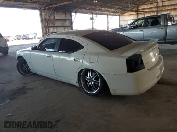 2009 Dodge Charger SXT z VIN 2B3KA33V39H573080, wystawiony jako Copart lot #77794044 z przebiegiem 117 601 mil mil oraz Szkoda całkowita • Salvage title. Historia ofert i sprzedaży dostępna na DreamBid. Obrazek 2.