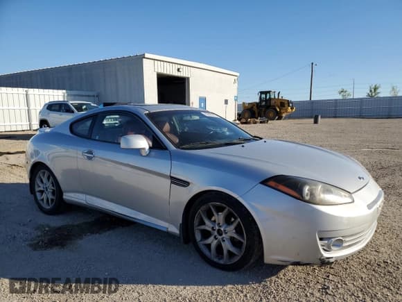 ✅ 2008 Hyundai Tiburon GT • VIN: KMHHN66F68U270322 • Лот: 85873875. Опубликован ранее на Copart с пробегом 181 595 миль. Бесплатный доступ к архиву аукционных продаж из США и подробный отчёт об истории автомобиля на DreamBid. Изображение 4.