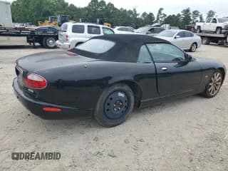 ✅ 2005 Jaguar XK XK8 • VIN: SAJDA42C052A40656 • Лот: 61458164. Опубликован ранее на Copart с пробегом 107 147 миль. Бесплатный доступ к архиву аукционных продаж из США и подробный отчёт об истории автомобиля на DreamBid. Изображение 3.