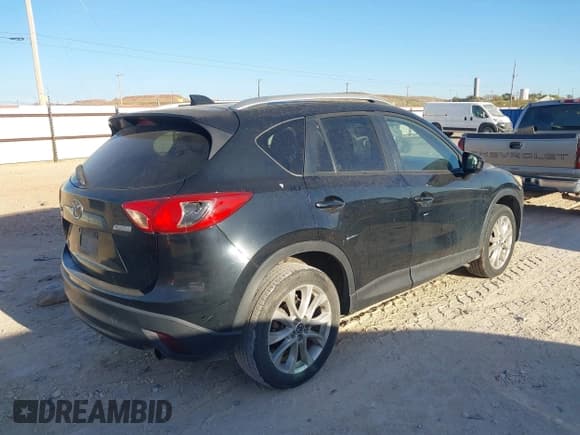 ✅ 2014 Mazda CX-5 Grand Touring • VIN: JM3KE2DY7E0345255 • Lot: 43668720. Listed on IAAI with 270,412 mi. Free auction sales archive from the USA and detailed vehicle history report at DreamBid. Image 4.