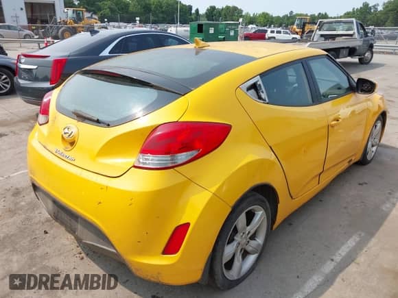 2012 Hyundai Veloster w/Gray Int z VIN KMHTC6AD5CU039913, wystawiony jako IAAI lot #42409269 z przebiegiem 177 079 mil mil oraz . Historia ofert i sprzedaży dostępna na DreamBid. Obrazek 4.