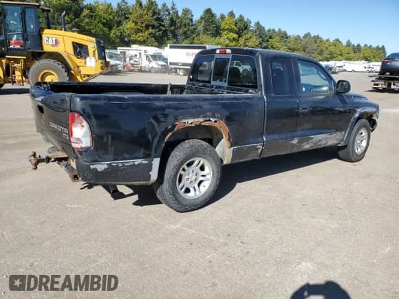 2003 Dodge Dakota SLT z VIN 1D7HL42X33S284170, wystawiony jako Copart lot #76657204 z przebiegiem 146 790 mil mil oraz Szkoda całkowita • Salvage title. Historia ofert i sprzedaży dostępna na DreamBid. Obrazek 3.