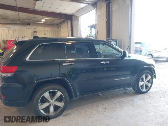 ✅ 2014 Jeep Grand Cherokee Overland • VIN: 1C4RJFCT1EC409613 • Lot: 43415659. Listed on IAAI with 173,712 mi. Free auction sales archive from the USA and detailed vehicle history report at DreamBid. Image 13.