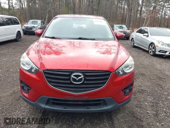 ✅ 2016 Mazda CX-5 Touring • VIN: JM3KE2CY3G0897193 • Lot: 43785978. Listed on IAAI with 119,937 mi. Free auction sales archive from the USA and detailed vehicle history report at DreamBid. Image 12.