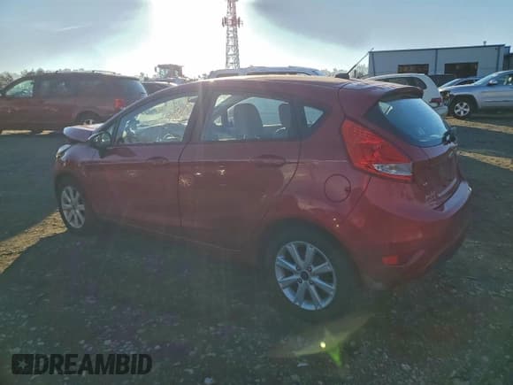 ✅ 2011 Ford Fiesta SE • VIN: 3FADP4EJ7BM223292 • Lot: 94945805. Listed on Copart with 104,549 mi. Free auction sales archive from the USA and detailed vehicle history report at DreamBid. Image 2.