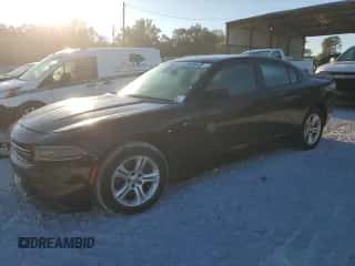 2015 Dodge Charger SE z VIN 2C3CDXBG3FH751493, wystawiony jako Copart lot #87234255 z przebiegiem 187 878 mil mil oraz Czysty tytuł • Clean title. Historia ofert i sprzedaży dostępna na DreamBid. Obrazek 1.