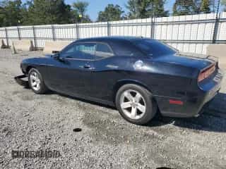 2014 Dodge Challenger SXT с VIN 2C3CDYAG5EH229969, выставлен на аукционе Copart как лот 85288785 с пробегом 194 859 миль миль и Списание • Salvage title. История ставок и продаж доступна на DreamBid. Изображение 2.