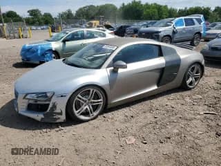 ✅ 2009 Audi R8 4.2L • VIN: WUAAU34219N002803 • Lot: 65063885. Listed on Copart with 62,833 mi. Free auction sales archive from the USA and detailed vehicle history report at DreamBid. Image 1.