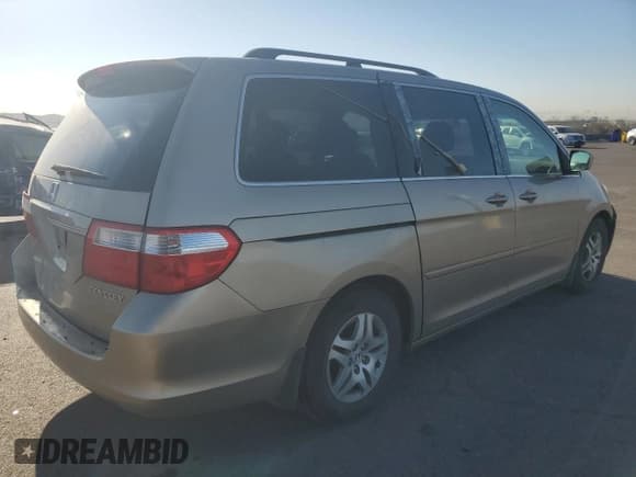 ✅ 2005 Honda Odyssey EX-L • VIN: 5FNRL38705B097212 • Лот: 92655085. Опубликован ранее на Copart с пробегом 162 776 миль. Бесплатный доступ к архиву аукционных продаж из США и подробный отчёт об истории автомобиля на DreamBid. Изображение 3.