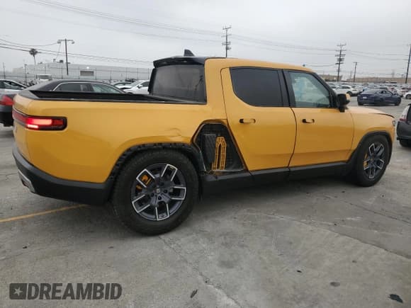✅ 2022 Rivian R1T Launch Edition • VIN: 7FCTGAAL2NN011755 • Lot: 59934185. Wystawiony na Copart z przebiegiem 12 261 mil. Bezpłatny archiwum sprzedaży aukcyjnych z USA i szczegółowy raport historii pojazdu na DreamBid. Zdjęcie 3.