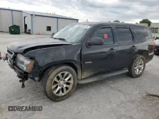 2014 Chevrolet Tahoe Commercial with VIN 1GNLC2E08ER142356, listed as a Copart auction lot 62602785 with 98,653 mi miles and Salvage title. Bid and sale history available at DreamBid. Image 1.