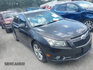 ✅ 2014 Chevrolet Cruze LTZ • VIN: 1G1PG5SB8E7329896 • Lot: 43251516. Listed on IAAI with 142,624 mi. Free auction sales archive from the USA and detailed vehicle history report at DreamBid. Image 1.