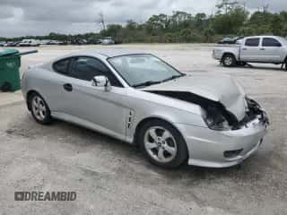 ✅ 2006 Hyundai Tiburon GS • VIN: KMHHM65D16U219309 • Лот: 86110765. Опубликован ранее на Copart с пробегом 166 452 миль. Бесплатный доступ к архиву аукционных продаж из США и подробный отчёт об истории автомобиля на DreamBid. Изображение 4.