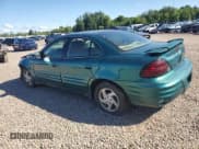 ✅ 1999 Pontiac Grand Am SE1 • VIN: 1G2NE52E6XC503882 • Lot: 64674975. Listed on Copart with 122,813 mi. Free auction sales archive from the USA and detailed vehicle history report at DreamBid. Image 2.