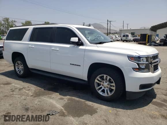 2019 Chevrolet Suburban LT with VIN 1GNSCHKCXKR207233, listed as a Copart auction lot 55410464 with 107,500 mi miles and Salvage title. Bid and sale history available at DreamBid. Image 4.