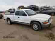 2000 Dodge Dakota z VIN 1B7GL22X4YS517720, wystawiony jako Copart lot #66695224 z przebiegiem 124 207 mil mil oraz Szkoda całkowita • Salvage title. Historia ofert i sprzedaży dostępna na DreamBid. Obrazek 4.