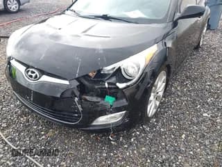 ✅ 2013 Hyundai Veloster w/Black Int • VIN: KMHTC6AD7DU092257 • Lot: 41464977. Wystawiony na IAAI z przebiegiem 151 152 mil. Bezpłatny archiwum sprzedaży aukcyjnych z USA i szczegółowy raport historii pojazdu na DreamBid. Zdjęcie 6.