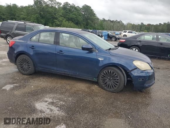 ✅ 2012 Suzuki Kizashi SE • VIN: JS2RE9A36C6100178 • Lot: 54519445. Listed on Copart with 103,342 mi. Free auction sales archive from the USA and detailed vehicle history report at DreamBid. Image 4.