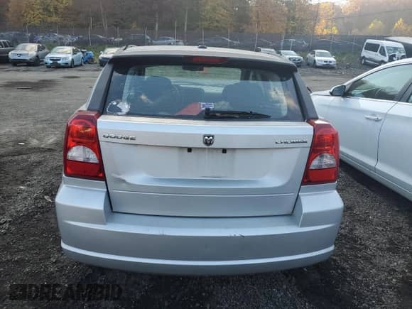 2011 Dodge Caliber Mainstreet with VIN 1B3CB3HA3BD123701, listed as a Copart auction lot 90858485 with 172,631 mi miles and Salvage title. Bid and sale history available at DreamBid. Image 6.