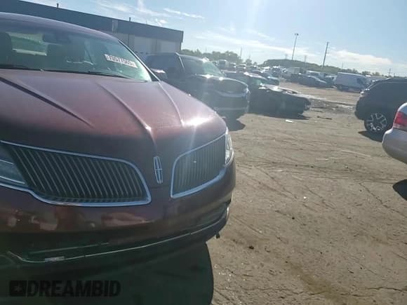 ✅ 2015 Lincoln MKS EcoBoost • VIN: 1LNHL9FT6FG604485 • Лот: 70577565. Опубликован ранее на Copart с пробегом 90 658 миль. Бесплатный доступ к архиву аукционных продаж из США и подробный отчёт об истории автомобиля на DreamBid. Изображение 13.