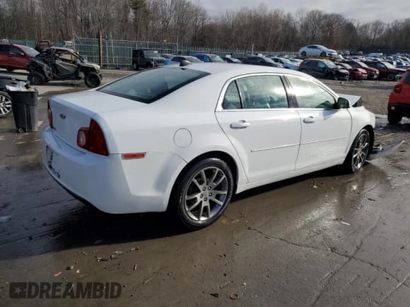 ✅ 2012 Chevrolet Malibu 1LS • VIN: 1G1ZB5E06CF203024 • Lot: 80666304. Listed on Copart with 69,447 mi. Free auction sales archive from the USA and detailed vehicle history report at DreamBid. Image 3.