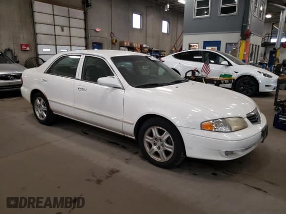 ✅ 2001 Mazda 626 LX • VIN: 1YVGF22D315203374 • Лот: 76926754. Опубликован ранее на Copart с пробегом 200 139 миль. Бесплатный доступ к архиву аукционных продаж из США и подробный отчёт об истории автомобиля на DreamBid. Изображение 4.