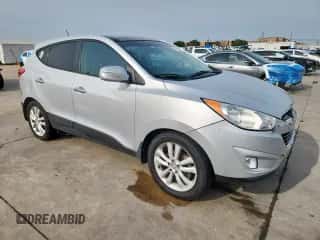 2013 Hyundai Tucson GLS with VIN KM8JU3AC7DU566198, listed as a Copart auction lot 71479605 with 196,474 mi miles and Salvage title. Bid and sale history available at DreamBid. Image 4.