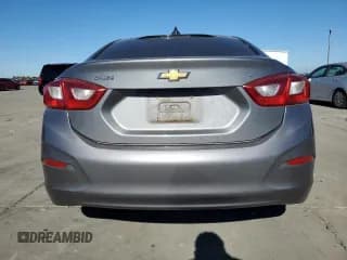 ✅ 2018 Chevrolet Cruze LT • VIN: 1G1BE5SM5J7136150 • Lot: 82736055. Listed on Copart with 138,719 mi. Free auction sales archive from the USA and detailed vehicle history report at DreamBid. Image 6.