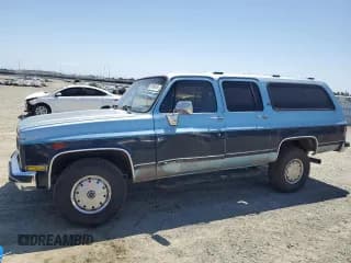 ✅ 1989 Chevrolet Suburban • VIN: 1GNGV26K0KF106072 • Lot: 57659815. Listed on Copart with 83,326 mi. Free auction sales archive from the USA and detailed vehicle history report at DreamBid. Image 1.