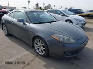 2007 Hyundai Tiburon GT z VIN KMHHN66F37U251290, wystawiony jako IAAI lot #41355889 z przebiegiem 135 374 mil mil oraz . Historia ofert i sprzedaży dostępna na DreamBid. Obrazek 1.