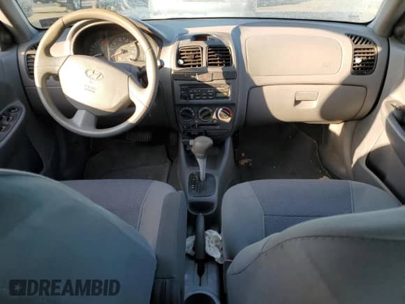 2005 Hyundai Accent GLS с VIN KMHCG45C85U588700, выставлен на аукционе Copart как лот 42792775 с пробегом 91 924 миль миль и Чистый • Clean title. История ставок и продаж доступна на DreamBid. Изображение 8.