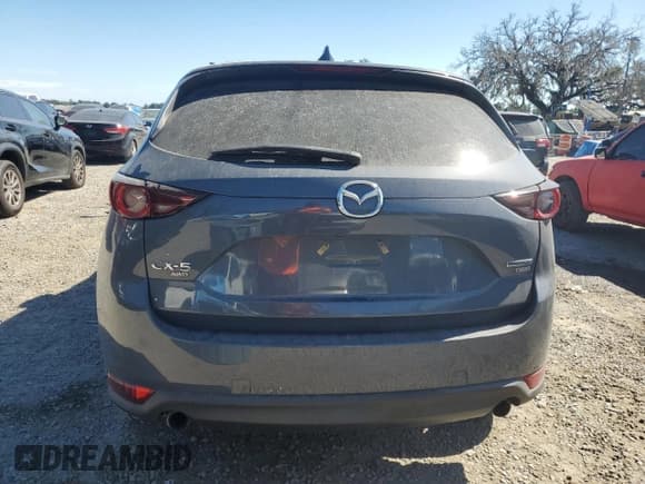 ✅ 2021 Mazda CX-5 Carbon Edition • VIN: JM3KFBCY6M0444467 • Lot: 86603305. Listed on Copart with 56,558 mi. Free auction sales archive from the USA and detailed vehicle history report at DreamBid. Image 6.