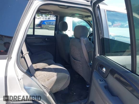 ✅ 2004 GMC Envoy SLE • VIN: 1GKDT13SX42427163 • Lot: 42829108. Listed on IAAI with 276,555 mi. Free auction sales archive from the USA and detailed vehicle history report at DreamBid. Image 8.