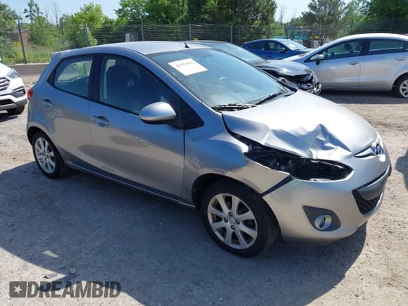 ✅ 2012 Mazda 2 Touring • VIN: JM1DE1LY7C0135068 • Lot: 42559008. Listed on IAAI with 143,251 mi. Free auction sales archive from the USA and detailed vehicle history report at DreamBid. Image 1.